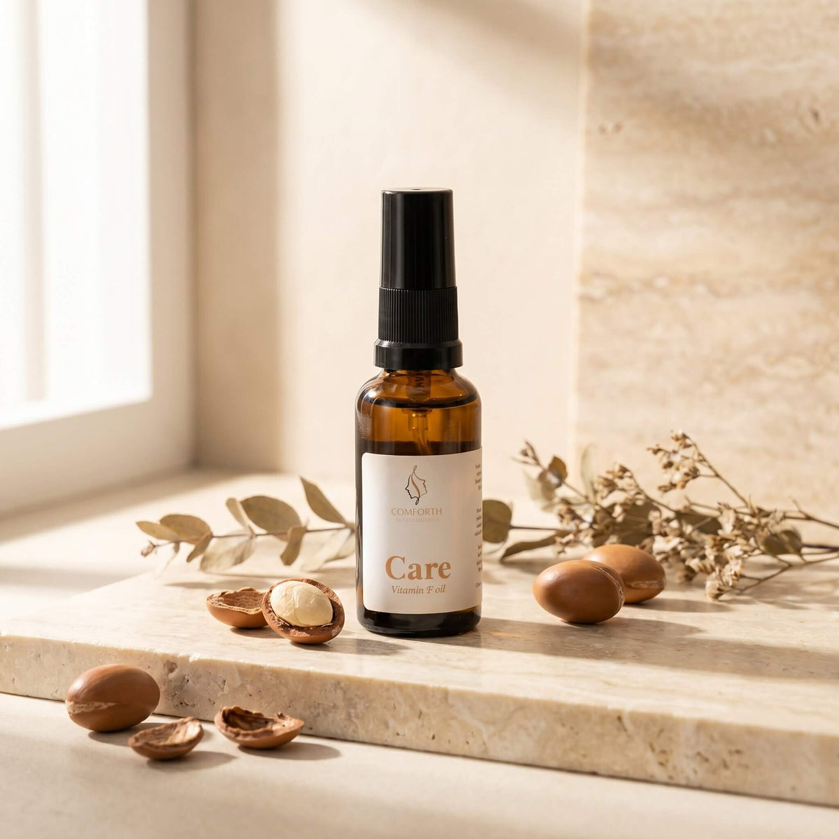 Comforth Care Vitamin F Oil ansiktsolje med nøtter på steinhylle
